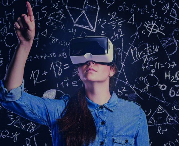 Woman using VR gear as part of virtual classroom training.